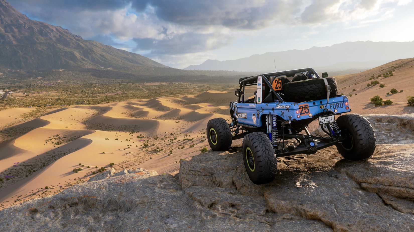 a Ford dune buggy on a ridge overlooking sand dunes in Forza Horizon 5