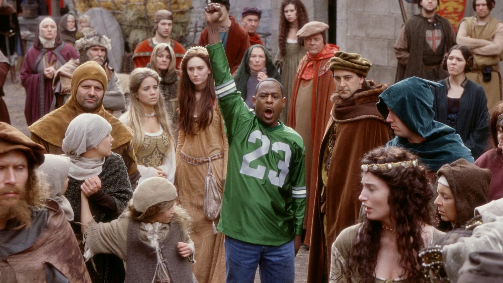 A black man raising his fist in medieval times. Martin Lawrence in the 2001 film Black Knight