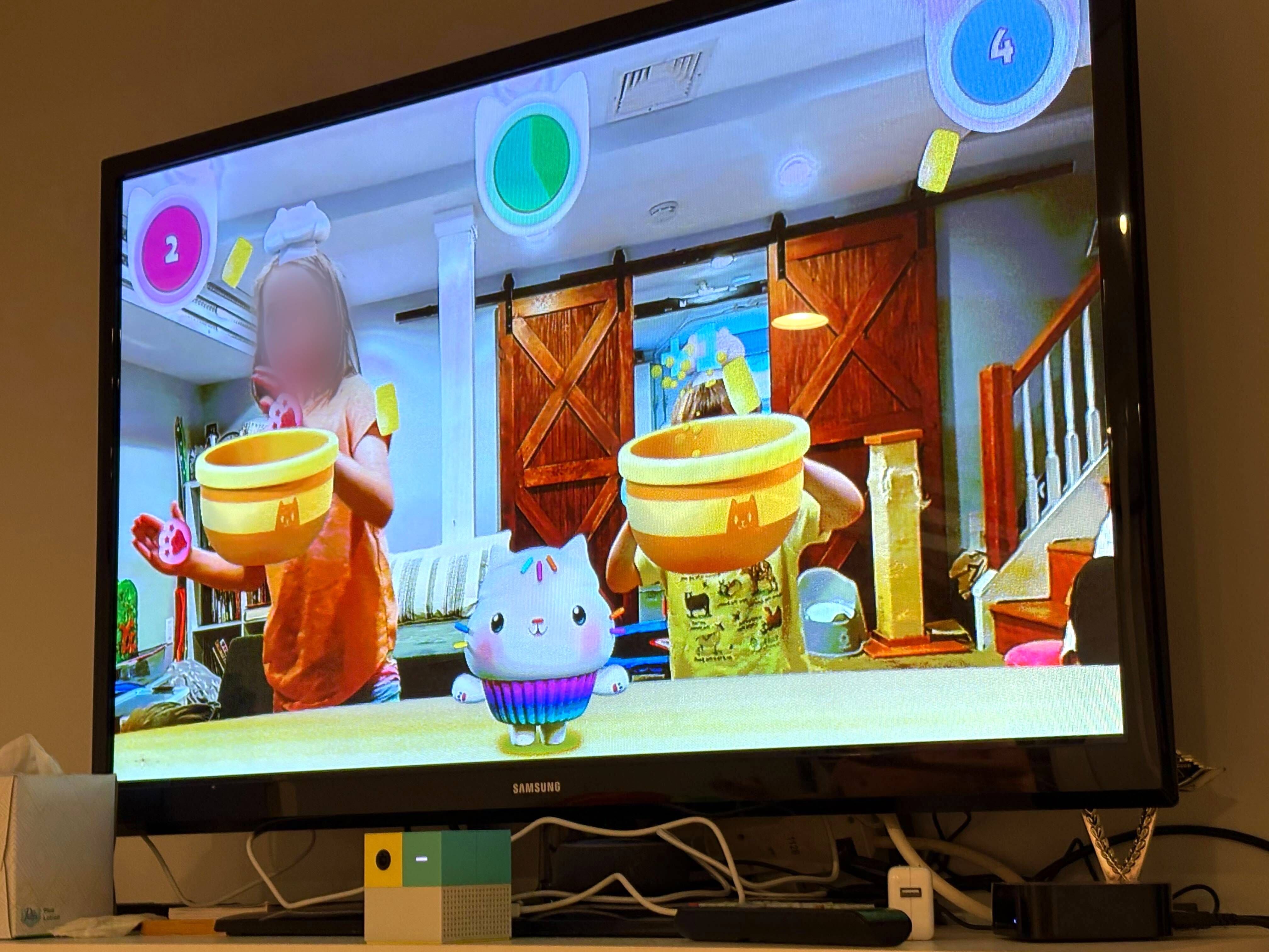 Two kids playing the Gabby's Dollhouse game on Nex Playground