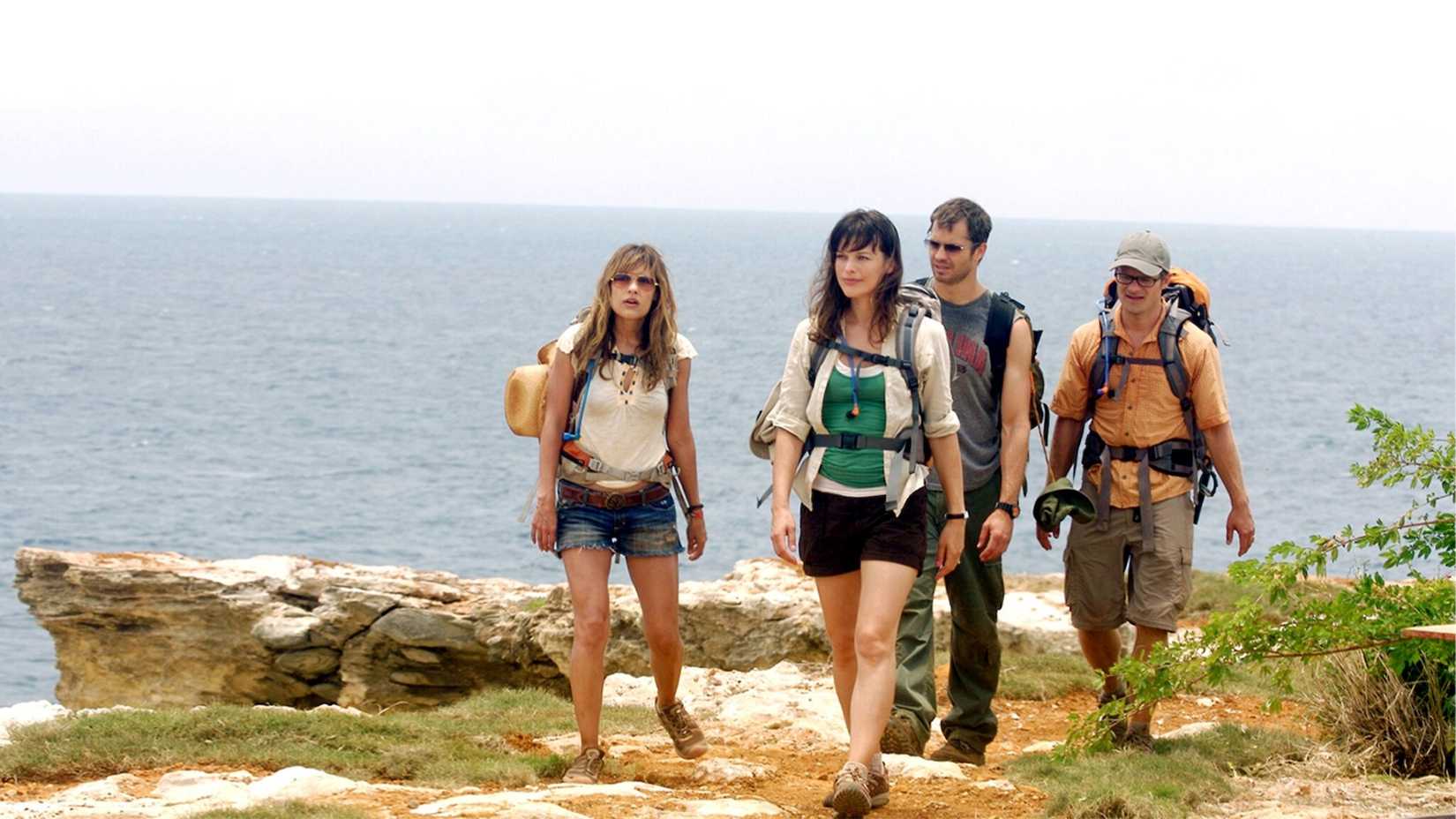 In this still from the 2009 thriller A Perfect Getaway, two couples played by Steve Zahn, Milla Jovovich, Timothy Olyphant, and Kiele Sanchez, hike together in Hawaii. 