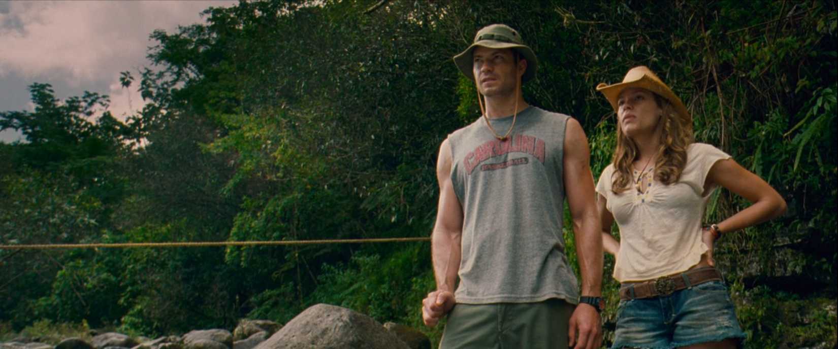Timothy Olyphant, playing a colorful backpacker, sizes up his new friends alongside his girlfriend played by Kiele Sanchez, in the 2009 film A Perfect Getaway.