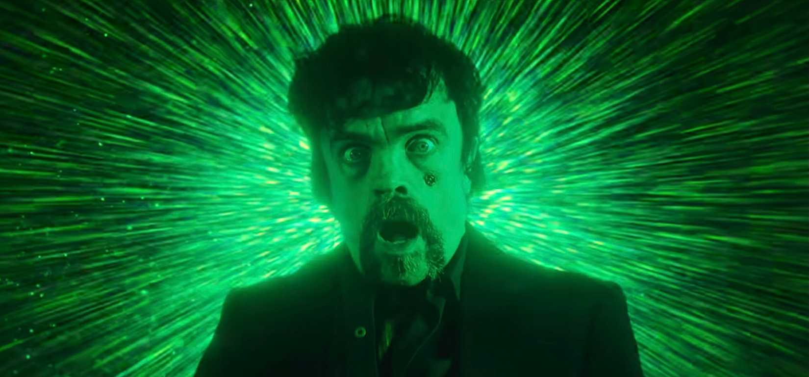 Peter Dinklage in a poison revenge, screaming and terrified by the explosion of the green light behind him