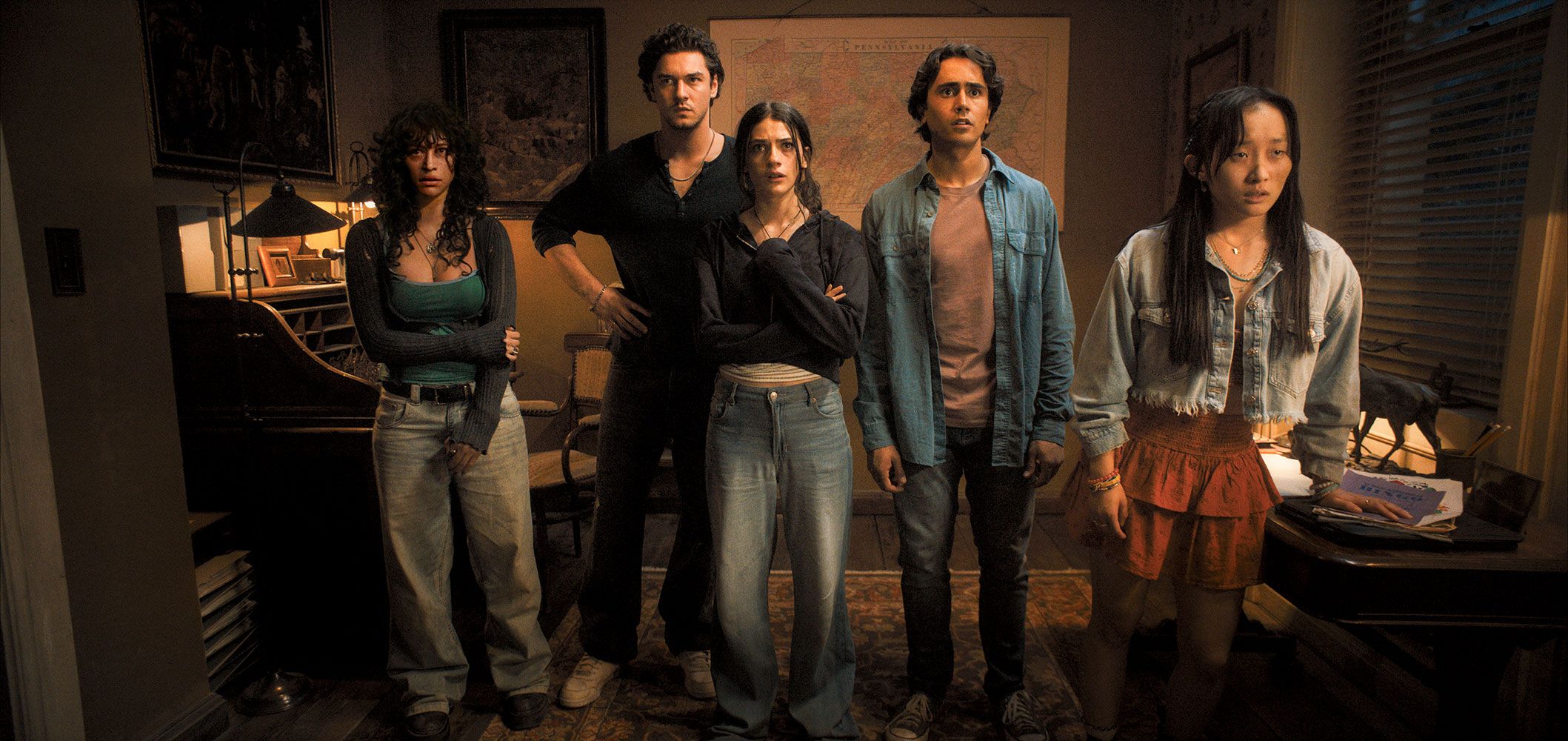 A group of 5 teens stand together. They all look distressed and injured. From the film adaptation of Until Dawn (2025)
