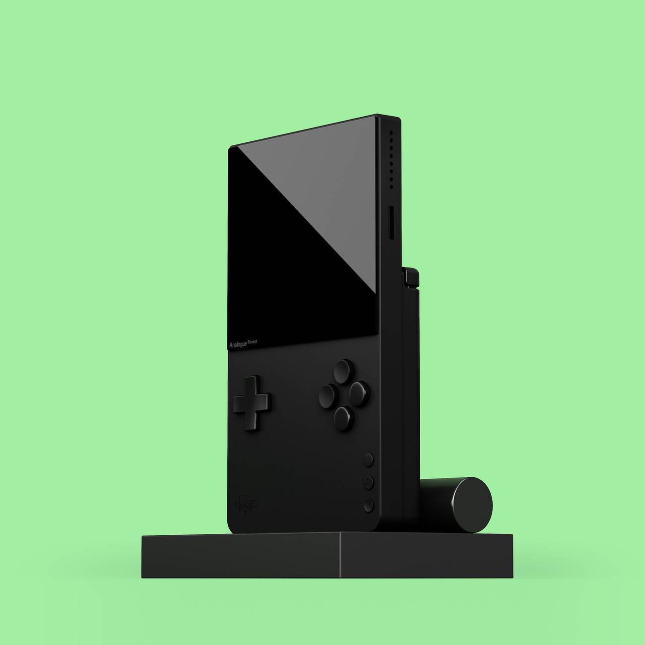 The Analogue Pocket sits upright in a TV out dock